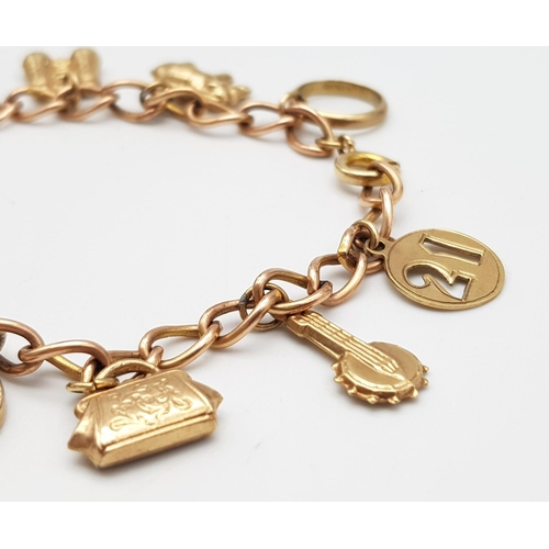 380 - A 9K Gold Charm Bracelet. 10 charms including: 10 shilling note, handbag and binoculars! 18cm length... 