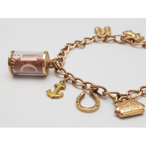 380 - A 9K Gold Charm Bracelet. 10 charms including: 10 shilling note, handbag and binoculars! 18cm length... 