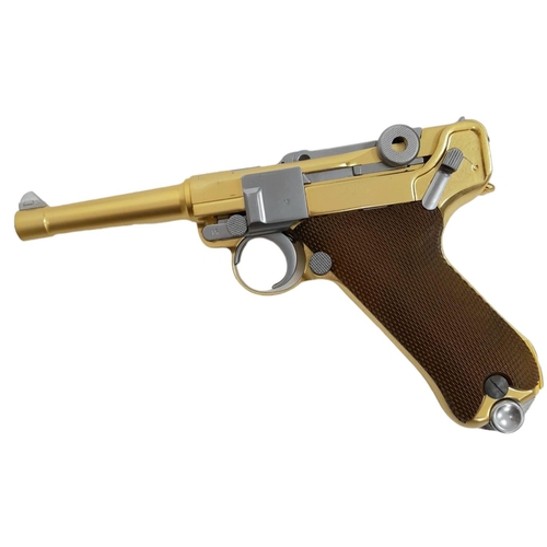 500 - A golden LUGER semi-automatic gas powered pistol. This is an exact replica of the real thing, firing... 