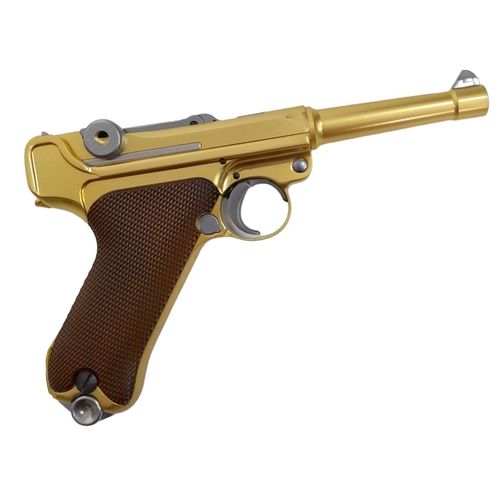 500 - A golden LUGER semi-automatic gas powered pistol. This is an exact replica of the real thing, firing... 