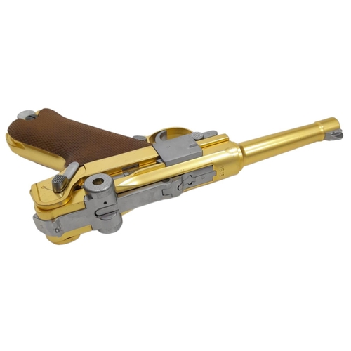 500 - A golden LUGER semi-automatic gas powered pistol. This is an exact replica of the real thing, firing... 