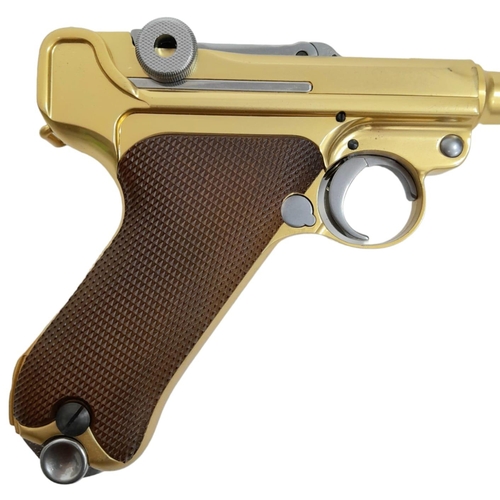 500 - A golden LUGER semi-automatic gas powered pistol. This is an exact replica of the real thing, firing... 