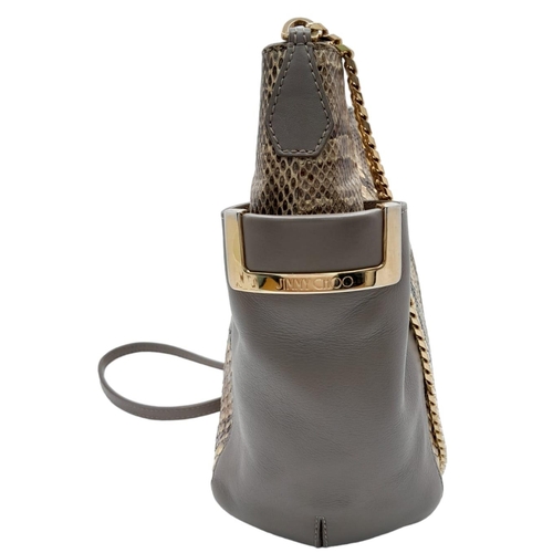 60 - A Jimmy Choo Taupe Snakeskin Crossbody Bag. Snakeskin and leather exterior with gold-toned hardware,... 