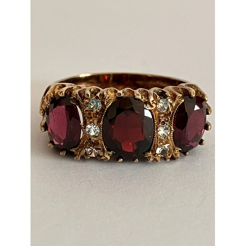 664 - Stunning SILVER and GARNET TRILOGY RING. Consisting three large Oval Cut GARNETS mounted to top with... 