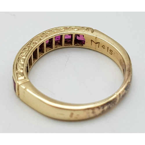 810 - A 9K GOLD CHANNEL SET RUBY BAND RING .  2.5gms   size J