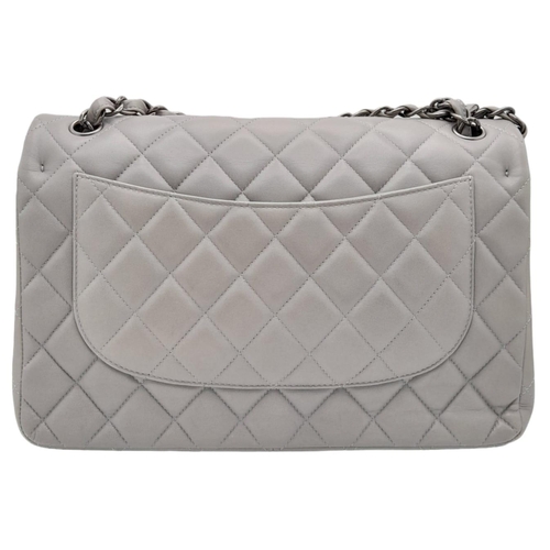 9 - A Chanel Grey Caviar Jumbo Classic Double Flap Bag. Quilted leather exterior with silver and chrome-... 