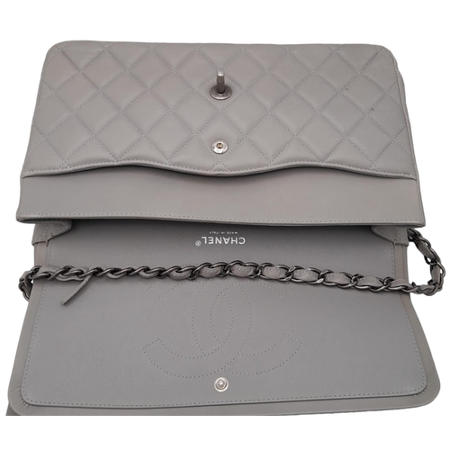 9 - A Chanel Grey Caviar Jumbo Classic Double Flap Bag. Quilted leather exterior with silver and chrome-... 