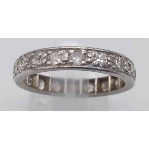 134 - A PLATINUM AND DIAMOND FULL ETERNITY RING .   3.9gms   size M