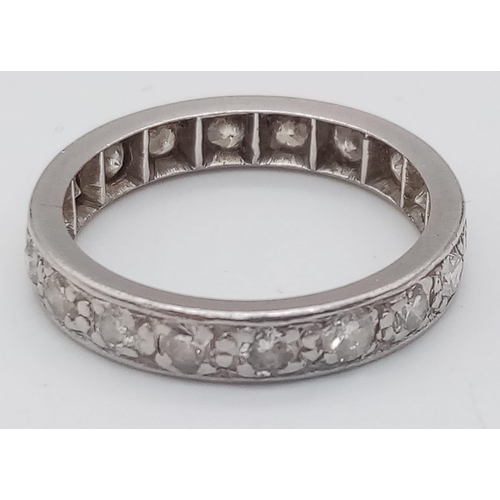 134 - A PLATINUM AND DIAMOND FULL ETERNITY RING .   3.9gms   size M