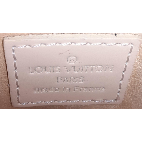 150 - A Louis Vuitton Vanilla Demi Lune Bag. Epi leather exterior with silver-toned hardware, thin leather... 