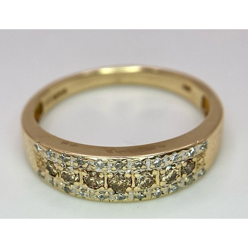 151 - A 9K YELLOW GOLD DIAMOND & CHAMPAGNE DIAMONDS SET 3 ROW RING 0.25CT 3.7G SIZE V 1/2

SC 4004