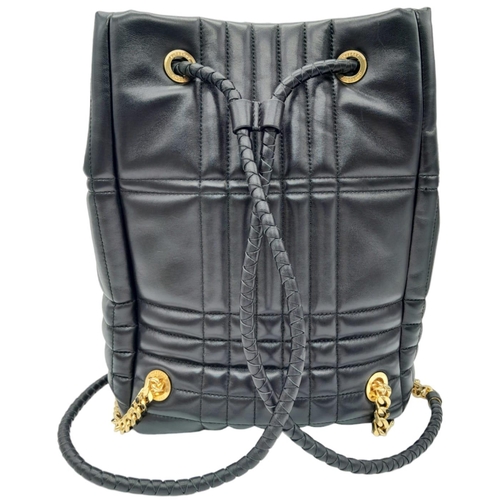 185 - A Burberry Black 'Lola' Backpack. Quilted leather exterior with gold-toned hardware, chain and leath... 