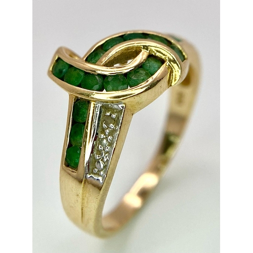 193 - A 14K GOLD DIAMOND AND EMERALD RING .   3.3gms   size O