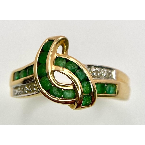 193 - A 14K GOLD DIAMOND AND EMERALD RING .   3.3gms   size O