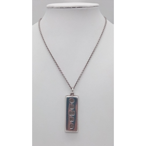 216 - A SOLID SILVER INGOT ON A 40cms SILVER CHAIN .  37.1gms