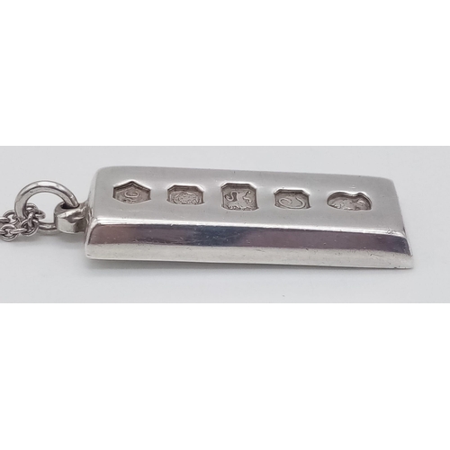 216 - A SOLID SILVER INGOT ON A 40cms SILVER CHAIN .  37.1gms