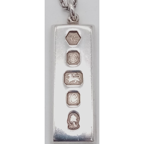 216 - A SOLID SILVER INGOT ON A 40cms SILVER CHAIN .  37.1gms