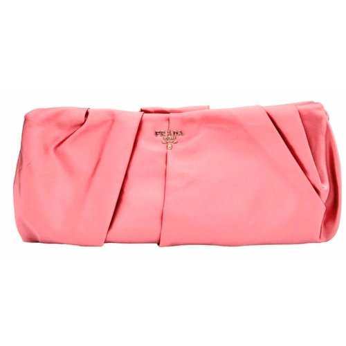 386 - A Prada Pink Pleated Clutch Bag. Satin exterior with silver-toned hardware and press lock closure to... 