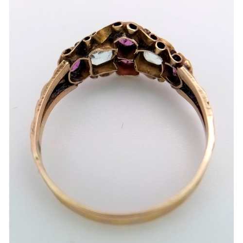 409 - An Antique George IV, 12K Gold, Ruby and Aquamarine Ring. Four bright pink rubies and two ice blue a... 