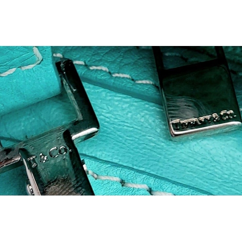 43 - A Tiffany & Co. 'Manhattan' Satchel Handbag. The iconic 'Tiffany blue' leather exterior with silver-... 