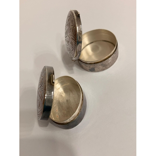 755 - 2 x Vintage SILVER PILL BOXES. To include oval and round shapes. Both having decorated lids and full... 