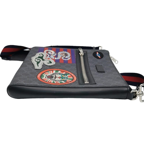 171 - A Gucci Monogram Night Courier Messenger Bag. Leather exterior with patch details, silver-toned hard... 