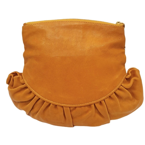 253 - A Christian Dior Caramel Ruffled Clutch Bag. Leather exterior with gold-toned hardware and a zipped ... 