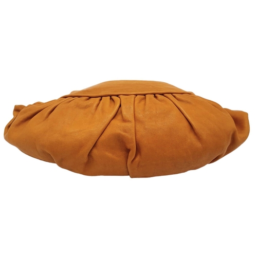 253 - A Christian Dior Caramel Ruffled Clutch Bag. Leather exterior with gold-toned hardware and a zipped ... 