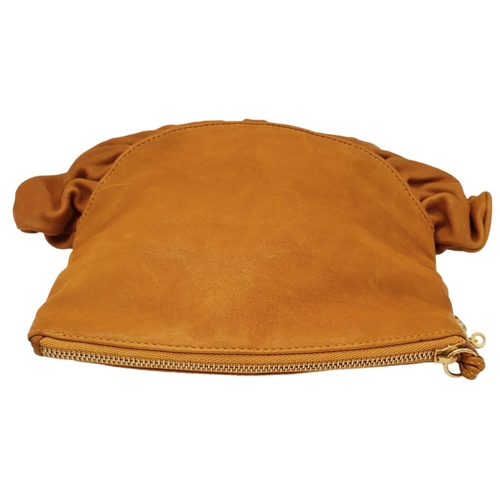 253 - A Christian Dior Caramel Ruffled Clutch Bag. Leather exterior with gold-toned hardware and a zipped ... 