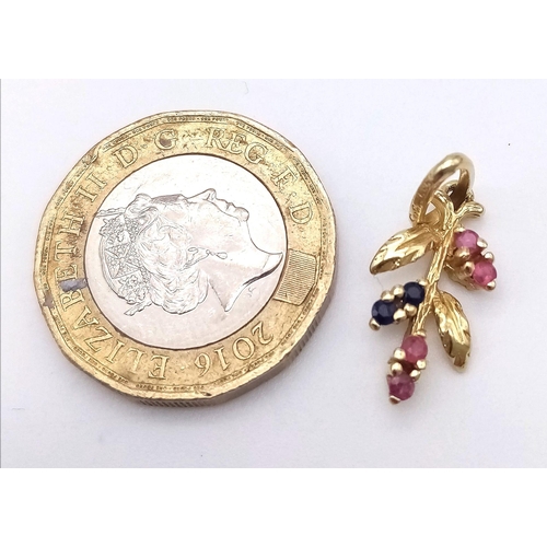 831 - A 14K GOLD PENDANT SET WITH RUBY AND SAPPHIRE  .  1.3gms