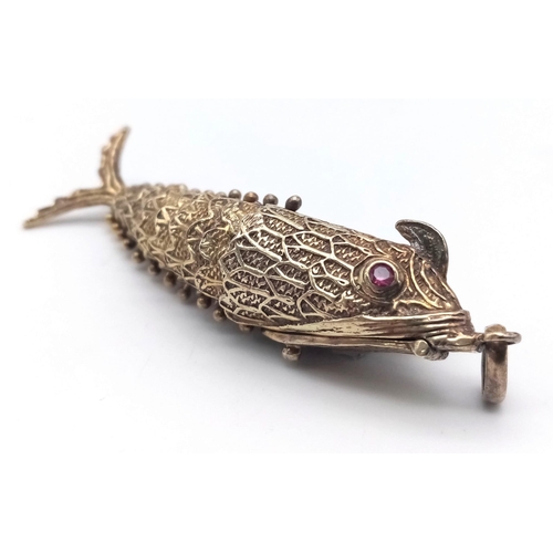 858 - A vintage sterling silver articulated fish pendant with Ruby eyes that converted into snuff box. Tot... 