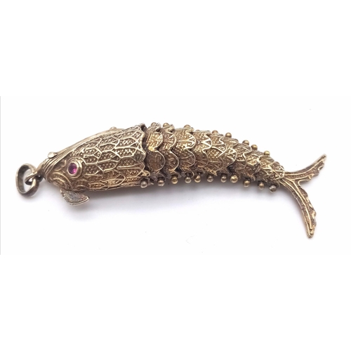 858 - A vintage sterling silver articulated fish pendant with Ruby eyes that converted into snuff box. Tot... 