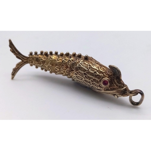 858 - A vintage sterling silver articulated fish pendant with Ruby eyes that converted into snuff box. Tot... 