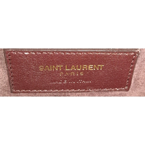 95 - A Saint Laurent Sac De Jour Burgundy Handbag. Leather Exterior, Gold Tone Hardware, Double Handle in... 