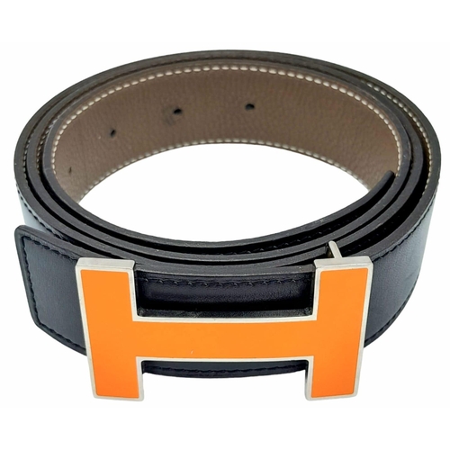 274 - A Hermes Black Leather H Logo Constance Changeable Belt. Silvertone H Buckle with Orange Enamel. Mar... 