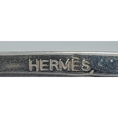 274 - A Hermes Black Leather H Logo Constance Changeable Belt. Silvertone H Buckle with Orange Enamel. Mar... 