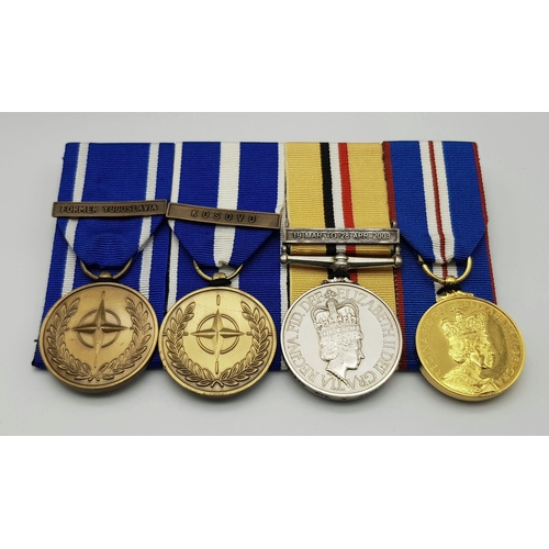 381 - A modern group of four medals to the Royal Logistic Corps. Consisting of:
NATO medal with clasp ‘For... 