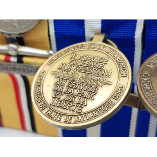 381 - A modern group of four medals to the Royal Logistic Corps. Consisting of:
NATO medal with clasp ‘For... 