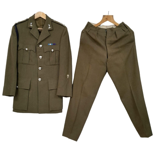 388 - A British Army Officer’s Service Dress jacket and trousers, mid-1960s vintage, with insignia for a L... 