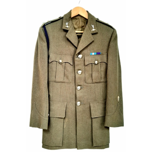 388 - A British Army Officer’s Service Dress jacket and trousers, mid-1960s vintage, with insignia for a L... 