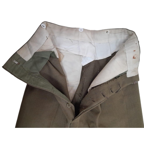 388 - A British Army Officer’s Service Dress jacket and trousers, mid-1960s vintage, with insignia for a L... 