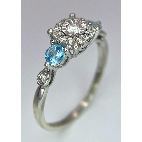 579 - A 9K WHITE GOLD DIAMOND & TOPAZ RING 2G SIZE O

SC 4011