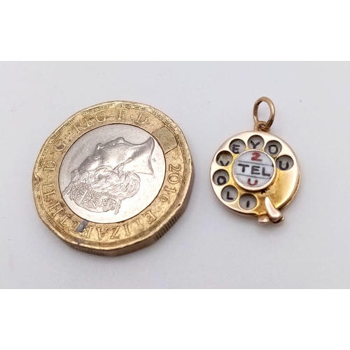 586 - A 9K YELLOW GOLD VINTAGE TELEPHONE DIALER CHARM WHICH SAYS  