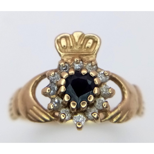 607 - A 9K YELLOW GOLD STONE SET CLADDAGH RING 2.35G SIZE O

SC 4034