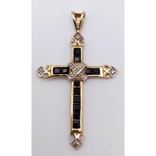 867 - A 9K YELLOW GOLD DIAMOND & SAPPHIRE SET CROSS PENDANT 1.1G , 35mm x 20mm

SC 4049