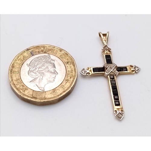 867 - A 9K YELLOW GOLD DIAMOND & SAPPHIRE SET CROSS PENDANT 1.1G , 35mm x 20mm

SC 4049