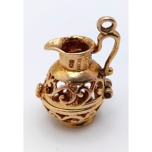 940 - A 9K Yellow Gold Decorative Pierced Jug Pendant/Charm. 2cm. 3.15g weight.