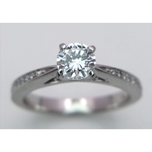 452 - A PLATINUM DIAMOND SOLITAIRE RING 0.50CT ROUND BRILIANT CUT MAIN STONE WITH ADDITIONAL DIAMOND SHOUL... 