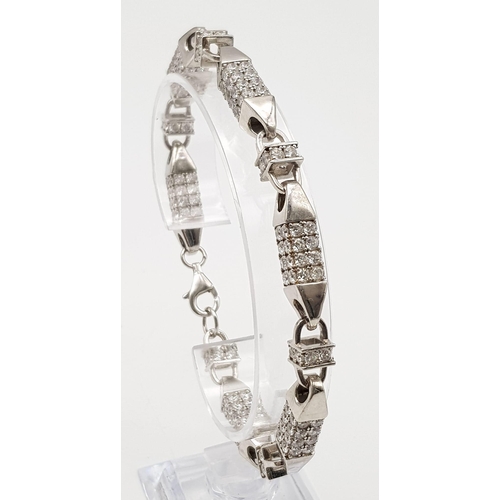 536 - A FANCY STERLING SILVER STONE SET BRACELET, TOTAL WEIGHT 33.3G AND 23CM LONG APPROX