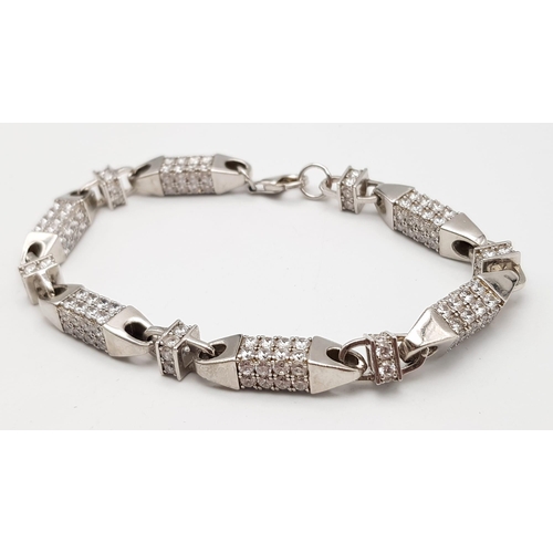 536 - A FANCY STERLING SILVER STONE SET BRACELET, TOTAL WEIGHT 33.3G AND 23CM LONG APPROX